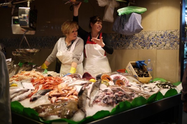 Fish vendors at  La Boqueria Mercat in Barcelona 
