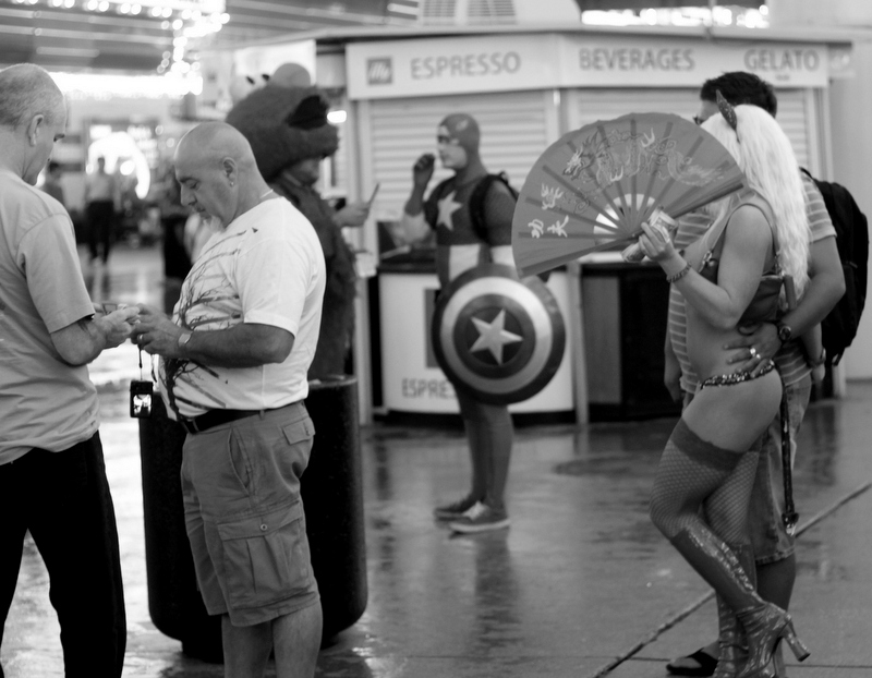 Tourists mingle with locals at the Fremont Street Experience