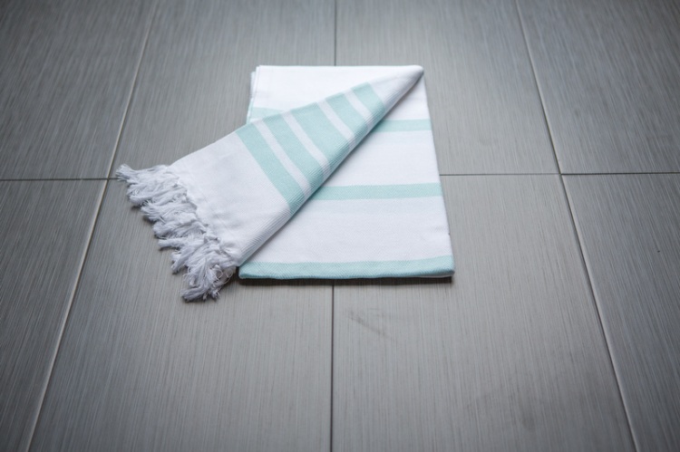 The Gift Guide for Travelers featuring only sustainable gifts and gifts which give back to local communities. Pictured: Findikli Design's Turkish Towel, which benefits local workers. For more, visit www.dtravelsround.com